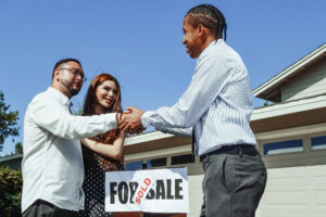 Real estate agent shaking hands with a client